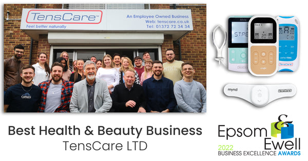 The TensCare team smiling in front of their office building, rallying votes for the Epsom Business Excellence Awards for which they are nominated for best health and beauty business for their TENS, EMS and IFT electrotherapy devices